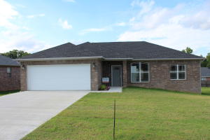 SOLID RESIDENCE HAS BEEN METICULOUSLY MAINTAINED! Generously proportioned rooms, brand new carpet, large living room, and formal dining room. 280 sq ft enclosed back porch offers tons of space and storage! Newly painted and cute as a button, its location is walking distance to the university. 2 fenced dog pens in the backyard.