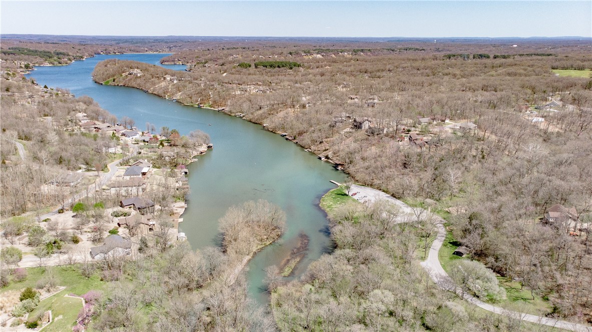 Excellent new construction opportunity in Bella Vista. This cul-de-sac lot offers a gentle slope perfect for building, with electric at the street and onsite septic required. Located just minutes from Loch Lomond and close to Highland Blvd, the property provides easy interstate access to Bentonville and is surrounded by bike trails and recreational amenities. Great potential for a custom residence, second home, or investment build in a highly sought-after location. Approved borrowers will receive a closing cost credit of 1% of the loan amount up to $5,000 on their Closing Disclosure on their loan closing with Envoy Mortgage Branch NMLS #2659248 and Branch NMLS #2579798.