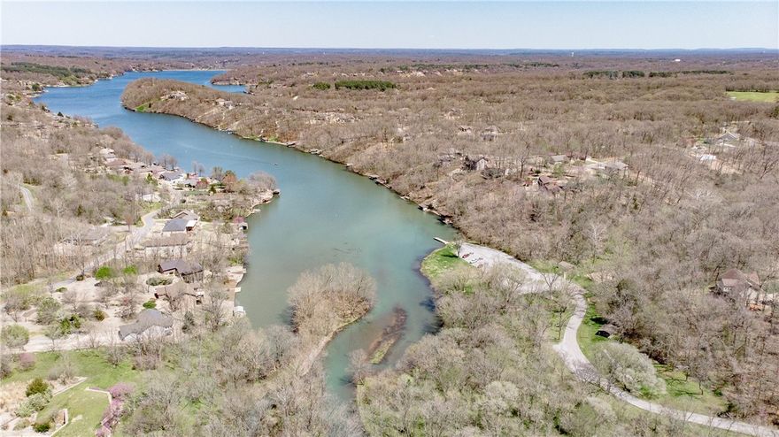 Excellent new construction opportunity in Bella Vista. This cul-de-sac lot offers a gentle slope perfect for building, with electric at the street and onsite septic required. Located just minutes from Loch Lomond and close to Highland Blvd, the property provides easy interstate access to Bentonville and is surrounded by bike trails and recreational amenities. Great potential for a custom residence, second home, or investment build in a highly sought-after location. Approved borrowers will receive a closing cost credit of 1% of the loan amount up to $5,000 on their Closing Disclosure on their loan closing with Envoy Mortgage Branch NMLS #2659248 and Branch NMLS #2579798.