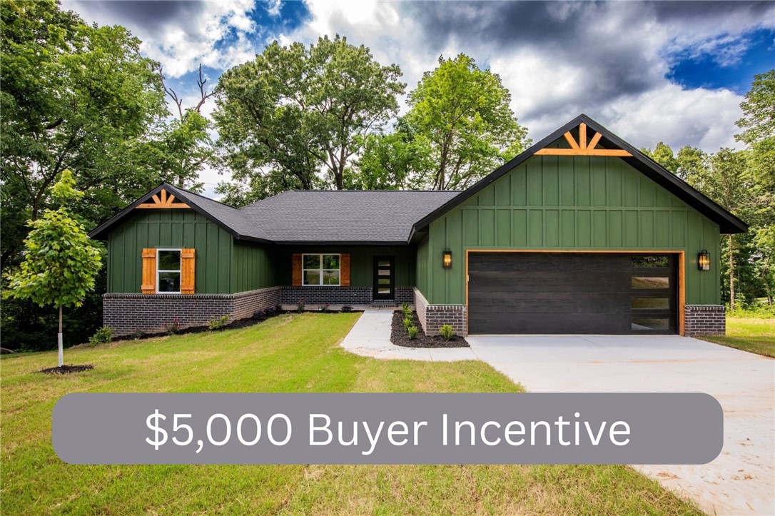 **$5,000.00** Buyer Incentive!! Come experience all the amenities Bella Vista has to offer, which includes seven golf courses including a world class practice facility, seven private lakes, miles of hiking and biking trails, swimming pools, a beach, parks and much more. This gorgeous three bed, two bath secluded home offers tons of upgrades like wood beams on the vaulted living room ceiling, electric fireplace, gas cook top, unique granite, beautifully painted custom cabinets, wood flooring in the main areas including the primary suite, large soaking tub and walk-in shower in the primary bath. There is a pre-wired blank outlet in garage for EV. Relax on the covered back deck.