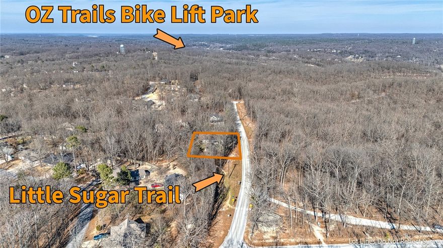 This rare flat lot is a mountain biker’s dream—just 1/10 mile from the Little Sugar Trailhead and less than a mile from the new OZ Trails Bike Park lift. Enjoy the perfect balance of outdoor adventure and everyday convenience with an easy drive to Bentonville Square and the Walmart Home Office.

The home is bright and welcoming, filled with natural light from abundant windows and a thoughtfully designed central-hall floor plan. It offers three bedrooms, dedicated office, and spacious sunroom. The guest bedroom features an en-suite bath, making it ideal for visitors or multigenerational living. An eat-in kitchen flows into a formal dining room, while custom cabinetry, under-cabinet lighting, and a wine bar add style and function for daily living.

Recent updates include new roof (2021), new garage door with MyQ smart opener and camera, and  eave lighting system that enhances curb appeal and security. The landscaped yard features an irrigation system and a fire pit—perfect for unwinding after a day on the trails.