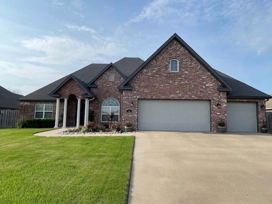 Beautiful brick 3 bedroom, 2 bath, split floor plan with bonus room and 3 car garage in gated Edinburgh Subdivision. All wood doors and crown molding throughout. Cozy up to your double-sided fireplace from the living area or eat-in kitchen. Granite counter tops. Front room could be office or formal dining area. Great location, close to shopping, biking and within minutes to I-49. Spacious privacy fenced backyard.