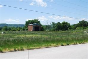 Vacant lot with 1 brick structure that is unused. Lot is fenced and has been used as outdoor soccer field by church league. Lot is level with all city utilities available at street. Ready for your new business or hold for future development. Bypass US 62 southern option will put this property between existing US 62 and new bypass for easy access to you property. See MLS listing #