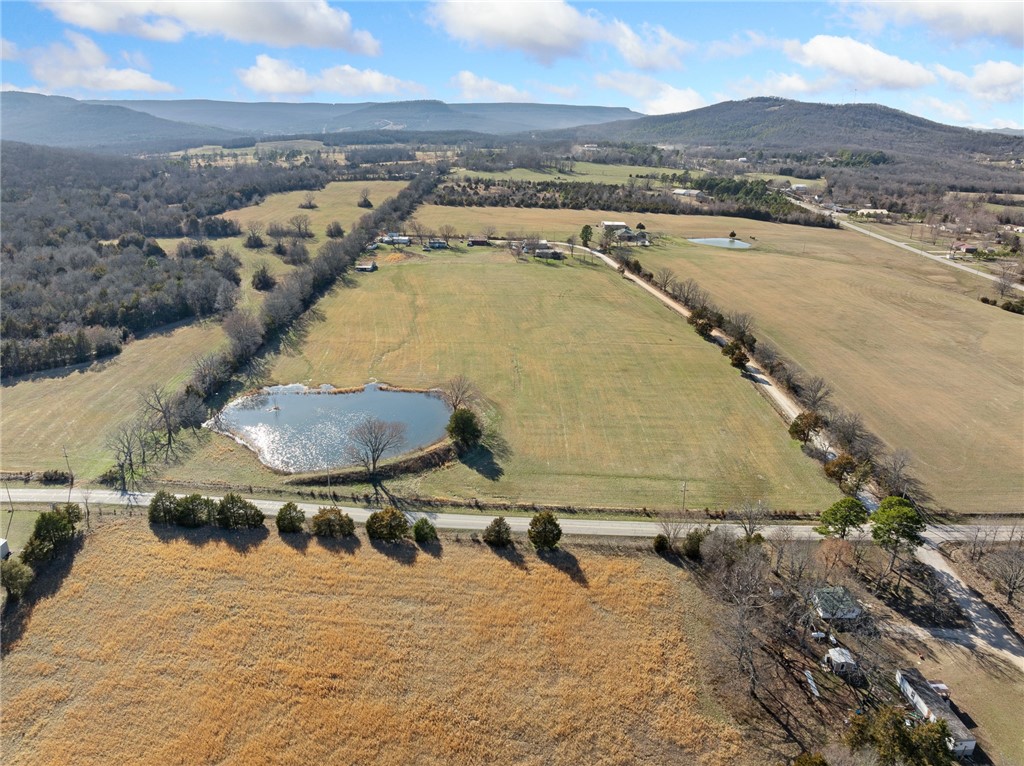 Discover the perfect blend of natural beauty and convenience with this stunning property just outside of Harrison, Arkansas. Featuring a mix of open pasture and mature woods, this property is ideal for farming, hunting, or building your dream home. A peaceful pond adds to the charm, providing a scenic spot for relaxation or recreation. Located on a quiet County Road, you'll enjoy the best of both worlds-easy access to city conveniences. Property is subject to court approval.
