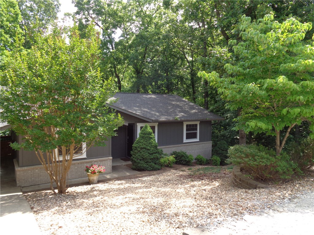 Gorgeous updated 1 level home with all the extra details that make it warm and inviting. Granite counters and hardwood floors. Ceramic tile in the bathrooms. New roof, new Pella Windows and sliding glass door leading onto the new deck. Backyard feels like a lush green oasis. Enjoy nature on your choice of two decks. Newer plumbing, septic, heat pump. Newer stainless appliances. Separate laundry room. Unattached storage building. Fenced dog kennel in back yard. This is your dream home!