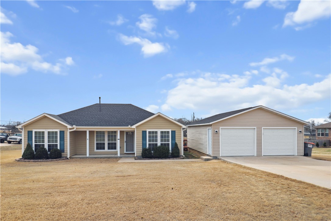 Welcome to 13049 Willow Oak Lane, where modern convenience meets peaceful country living. This well-maintained 3-bed, 2-bath home offers stunning views of a private pond and pastoral scenes with horses and cattle grazing nearby. Recent upgrades include a new architectural shingle roof, ultra-quiet MyQ smart garage door openers in the oversized 30x24 garage, and double-pane vinyl windows throughout. The home features durable HardiBoard siding, fresh paint, elegant crown molding, and included Google Nest. The backyard showcases multiple raised garden beds, a cozy fire pit, and 2 back patios plus a front porch. A convenient deck connects the main house to the garage, and there's a dedicated dog run. The 11x11 storage unit provides ample space for extras. Inside, find a walk-in pantry and kitchen complete with refrigerator and electric range. Additional features include Cox fiber connectivity, ceramic tile and carpet flooring, walk-in closets. Experience tranquil living while staying connected to Rogers' amenities.
