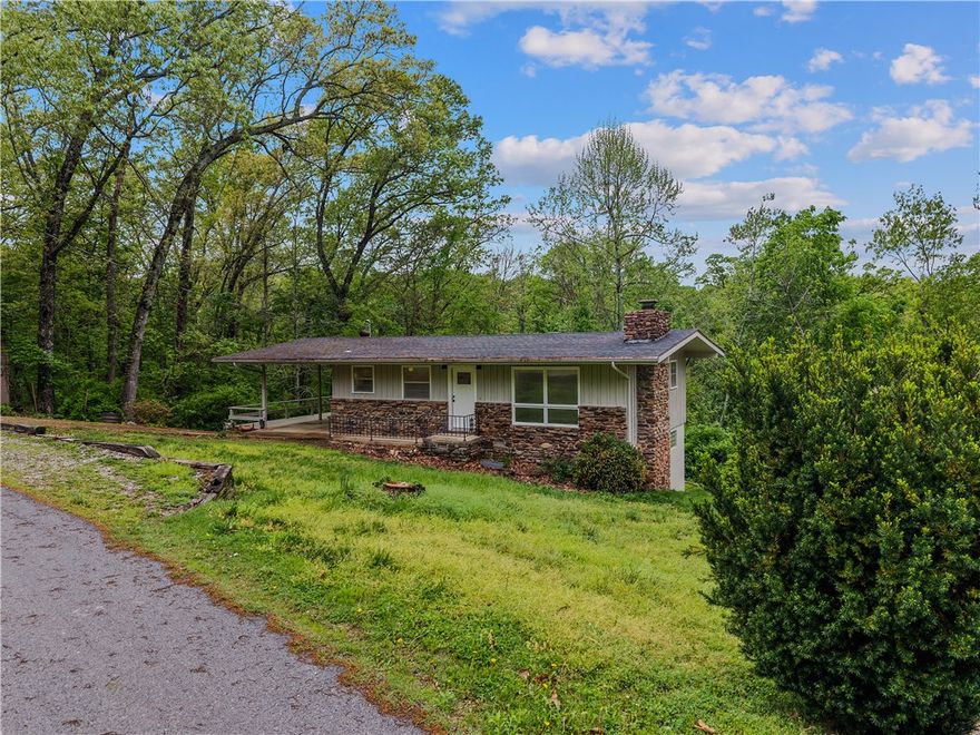 Tucked in the trees in the heart of Bella Vista, this remodeled cottage is the kind of property that works however you need it to. Warm finishes and a wood-burning stove give it the cozy character that feels intentional. Private wooded backyard, natural light, and a layout that just lives well. The unfinished basement adds real upside..expand, add a bunk room, gear/bike storage, or build to fit your vision. Less than half a mile to Lake Avalon, with golf and outdoor recreation right in the neighborhood. First home, weekend getaway, or STR investment..this one checks the box regardless of how you run it.