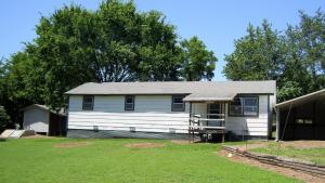 THIS 3 BEDROOM 1 BATH HOME IN HARTMAN HAS A NICE STORM CELLAR, CARPORT & STORAGE SHED ON A HALF ACRE, And, With A Little Work, This Would Make a Nice Home Or Rental Investment. This is A Fannie Mae Home Path Property.
