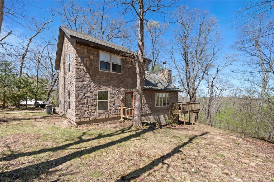 Tucked away in the scenic hills of Winslow, this beautifully maintained home sits on 10 private, wooded acres—offering a peaceful escape from city life. Surrounded by nature, it’s ideal for full-time living or a short-term rental retreat. The land gently surrounds the home, with a more heavily sloped terrain behind—enhancing privacy, natural beauty, and a true sense of seclusion. Inside, you’ll find 2 bedrooms + 2 bathrooms, plus two flex spaces upstairs for additional bedrooms, offices, or hobbies. The living area features a cozy wood-burning fireplace, while the eat-in kitchen provides a warm, functional space for gathering. Step onto the deck and take in the breathtaking views—perfect for relaxing, entertaining, or enjoying the surrounding woods. Major updates include a new roof (2018), HVAC (2022), and water heater (2025). Whether you’re seeking a quiet getaway or income-producing property, this Winslow gem blends comfort, privacy, and nature.