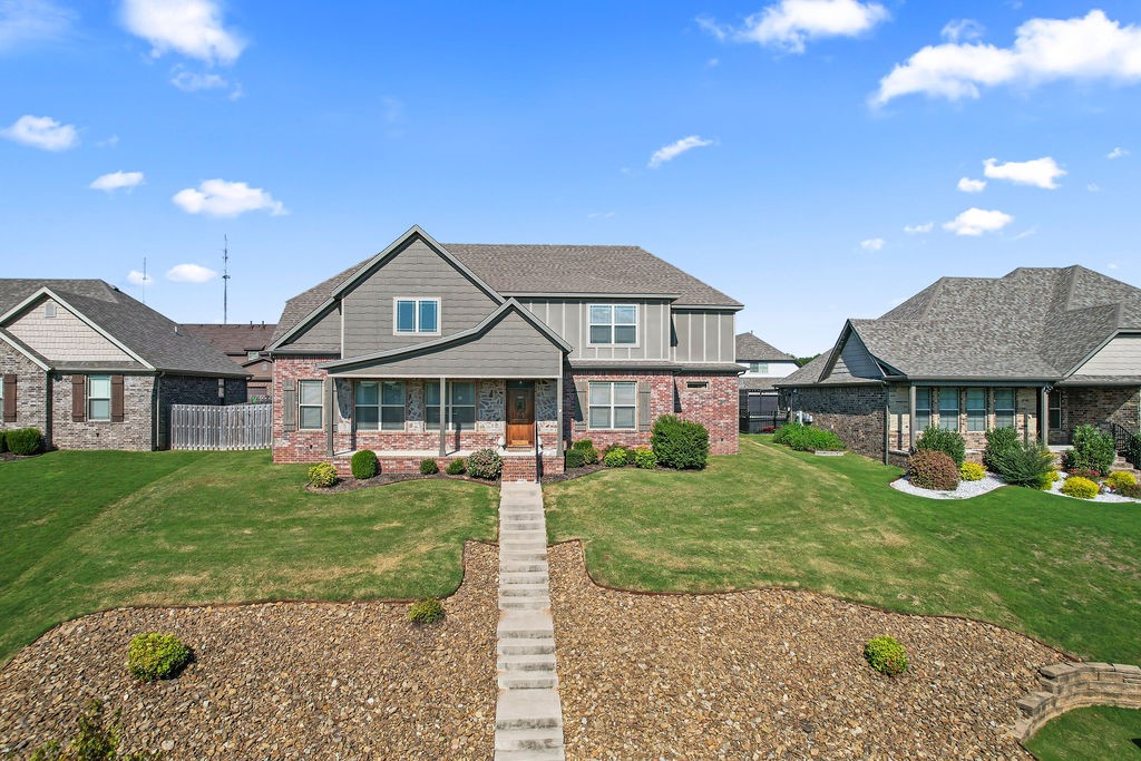 This 4BD/2.5BA home has it all: space, thoughtful design & a prime location! The living room, with vaulted ceilings opening to an upstairs balcony, welcomes you to the open-concept main level & includes a gas fireplace. The eat-in kitchen features granite countertops, counter seating, SS appliances, a large island, walk-in pantry & spacious dining area. The main-level primary suite offers a generous ensuite with 2 vanities, a fully tiled walk-in shower, whirlpool tub & oversized walk-in closet. Upstairs, youāll find 3 bedrooms, a full bath w/ dual vanity & a bonus room perfect as a playroom, office or 5th bedroom. The laundry/mud room, just off the kitchen, features built-ins & leads to the 3-car garage The fully fenced backyard includes a covered patio for outdoor entertaining & an exterior storage closet while the covered front porch overlooks beautiful landscaping and foliage across the street. Donāt miss your chance to own just minutes from Downtown Bentonville, the new Home Office Campus, I-49 & NWA trails!