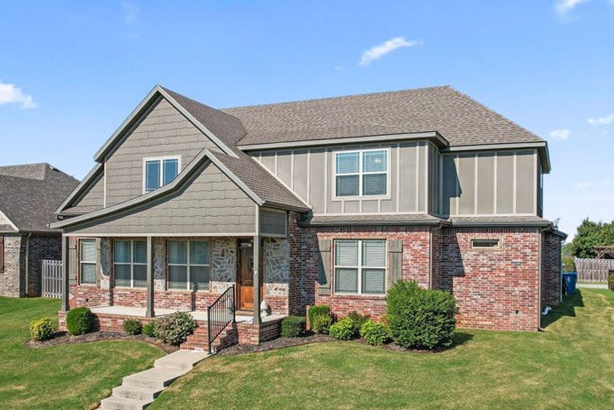 This 5BD/2.5BA home has it all: space, thoughtful design & a prime location! The living room, with vaulted ceilings opening to an upstairs balcony, welcomes you to the open-concept main level & includes a gas fireplace. The eat-in kitchen features granite countertops, counter seating, SS appliances, a large island, walk-in pantry & spacious dining area. The main-level primary suite offers a generous ensuite with 2 vanities, a fully tiled walk-in shower, whirlpool tub & oversized walk-in closet. Upstairs, you’ll find 4 bedrooms & a full bath w/ dual vanity. 5th bedroom currently used as a bonus room/second living room! The laundry/mud room, off the kitchen, features built-ins & leads to the 3-car garage The fully fenced backyard includes a covered patio for outdoor entertaining & an exterior storage closet while the covered front porch overlooks beautiful landscaping and foliage across the street. Don’t miss your chance to own just minutes from Downtown Bentonville, the new Home Office Campus, I-49 & NWA trails!