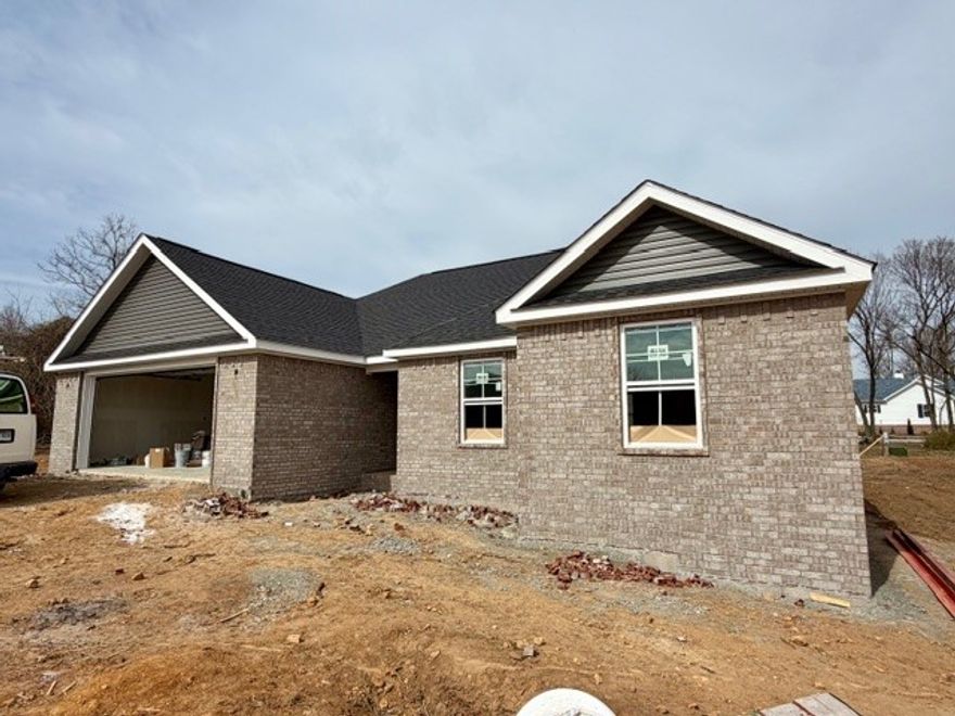 New Construction with Custom Touches! This beautifully built 3-bedroom, 2-bath home on a larger lot offers 1,500 sq ft of thoughtfully designed living space by a custom home builder known for attention to detail. Featuring an all-brick exterior, this home includes custom cabinetry, granite countertops, and stainless steel appliances that bring both style and function to the kitchen. Enjoy outdoor living on the covered back porch. The yard will be sodded in the front and sides, with seed in the backyard, making it easy to move in and enjoy right away. Quality craftsmanship, timeless finishes, and a smart layout make this home a must-see!