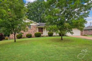 Conveniently located near the golf course, this brick home has fresh updates that make it ready for you to move in! Solid surface kitchen counter with all the appliances. Plenty of cabinet space with a kitchen island. Beautiful oak hardwood floors and new carpeting throughout. The bathrooms have be updated with new vanities. Covered patio, fenced backyard, hot tub, and above ground pool make the backyard your relaxing escape from a busy day. Golf Cart access to the Harrison Country Club in cul-de-sac at end of Bogy. Basement family room could easily serve as a 4th bedroom. Basement garage space is in addition to the 2 car garage. Fireplace insert in the living room makes for energy efficiency heat during the winter months. (buyer responsible for inspecting/cleaning fireplace)