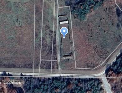 Sold before print -1.02 acres - open, previously used as a gun range.