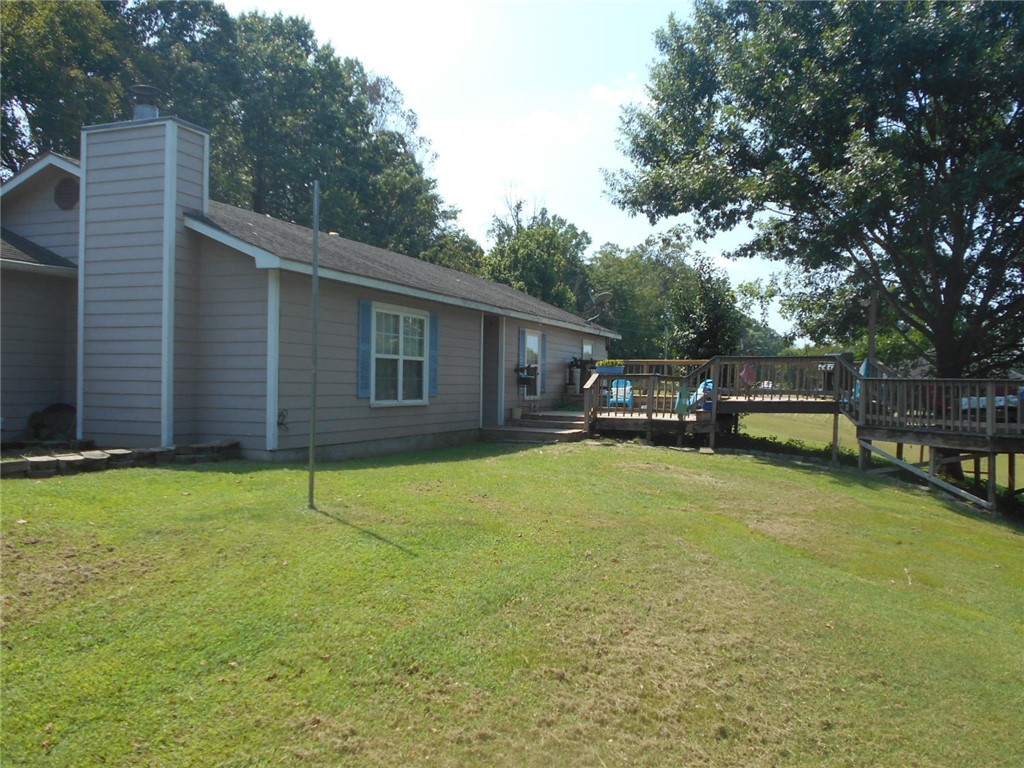Nice 1 acre lot. Relax on wonderful multi-level wood deck or in front of the nice woodburning fireplace. Home features 3 spacious bedrooms with nice size closets, 2 full bathrooms, large living room, dining area, utility/mudroom and garage. Cathedral ceilings in the living room are an added touch. Located close to schools and Hwy 412 E, this convenient location is sure to please. Storage building, washer/dryer and fridge do not convey.
