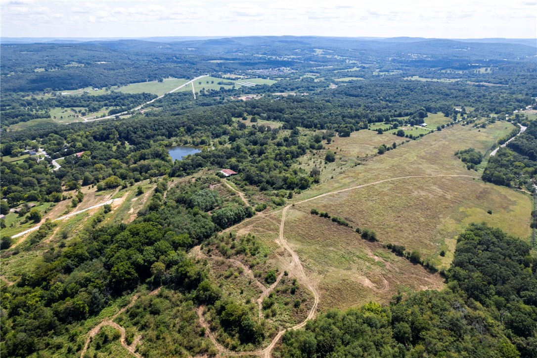 Welcome to 4.09 beautiful acres in Greenland, Arkansas. This property offers the perfect blend of open space and natural beauty, making it an ideal spot to build your dream home, start a hobby farm, or simply enjoy the peace of country living. The land features a mix of cleared pasture and mature trees, providing both usable space and privacy. With gentle terrain and a versatile layout, you’ll have plenty of room for livestock, gardening, or recreational use. Conveniently located just minutes from Fayetteville and I-49, you can enjoy the quiet of the countryside while staying close to city conveniences. Acreage in this area is becoming increasingly rare, making this a wonderful opportunity to own a piece of Northwest Arkansas countryside. Don't miss this opportunity