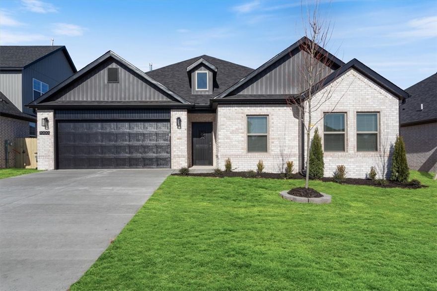 Builder is offering up to $7,500 towards closing costs, interest rate buy down or towards an appliance package! The "ROSS" plan boasts a spacious single story open-concept layout with luxurious finishes including vaulted ceilings, quartz countertops, inviting entry way, upgraded lighting fixtures, custom cabinets, black stainless steel appliances, gas fireplace, gas range, oversized tiled walk in shower in primary bathroom with rainfall shower head & luxury vinyl plank floors throughout. Enjoy standard inclusions such as insulated garages, full home gutters, privacy fence, & 2” blinds throughout. Community pool coming in Phase 2! Under 10 minutes to XNA Airport and under 20 minutes to Downtown Bentonville and New Walmart Campus. South Facing!