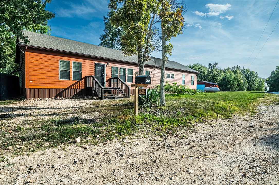 Come check out this spacious 4-bedroom, 2.5-bath manufactured home on 20+ acres. The heart of the home is the kitchen, boasting abundant cabinet space, a large island with built-in wine rack and storage, plus a new single-bowl sink. The luxurious master suite is a true escape with whirlpool tub, walk-in shower, double vanities, makeup area, and two walk-in closets. Gather in the open living areas or step out onto the back deck to take in postcard-worthy views. There are multiple large water catchment systems in place, providing an additional reliable water source that is especially valuable for country living. A brand new 24x30 metal shop offers space for hobbies, projects, or storage. With room to roam and relax, this property is a must see with stunning sceneryāperfect for country living at its finest.