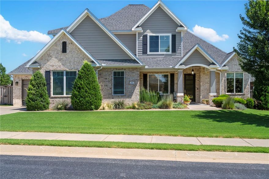 Absolute stunner! This gorgeous home in the prestigious gated community Oak Tree will leave an incredible impression. Impeccably maintained, every inch is designed for beautiful esthetics and perfect function. The chef's kitchen including hidden pantry and spacious dining area are perfect for culinary creations and ease of entertaining. The space extends onto the lovely covered patio complete with outdoor kitchen and wood burning (gas assist) fireplace for year-round enjoyment. The backyard is magical with stone wall, fence and natural landscaping forming a completely private oasis. Plenty of space for a future pool or the active lifestyle. Back indoors, a 2nd bedroom on the main level is perfect for guests, an office, or a kid's room. The primary suite is spacious and inviting with the walk in closet connecting seamlessly to the laundry and drop zone area. The stained concrete and LVP flooring are perfect for active people and pets. Fabulous community amenities are the icing on the cake for this amazing home!