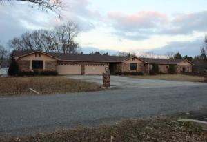 Lakefront property. Lots of living area pluse 4 car garage and workshop. 2 enclosed porches and 2 enclosed storage rooms. Fenced backyard. Square footage based on recent appraisal.
