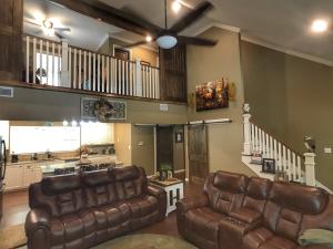 Don't Miss Out on this Beautiful home with 16.29 secluded acres. This newly built home offers all the latest and greatest improvements and updates you've been wanting (and no detail was left out)! Granite counter-tops, barn doors for every room and closet, hard wood floors throughout, custom cabinets in the kitchen and bathrooms, Ball Canning light fixtures, and so much more... There are three bedrooms, two and a half bathrooms, a large open living room and kitchen, walk-in closets and a beautiful loft overlooking the house. All of this on 16.29 wooded acres situated back off the road.