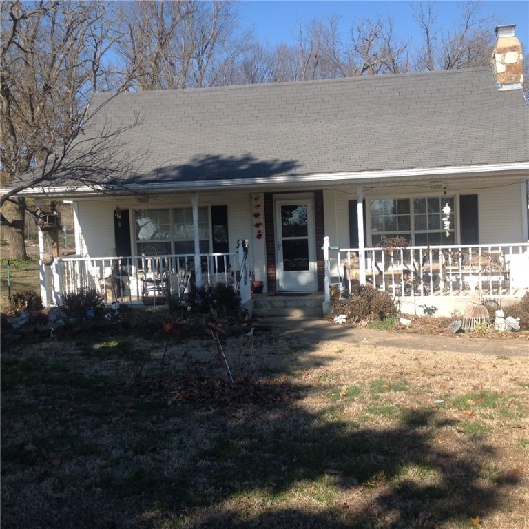 Fabulous buy on almost 7 acres with a very nice farmhouse, two detached garages, one garage has a good shop, rv storage, barn, horse shed, kennel, fenced, large shade trees, has a generator for emergencies, includes a well for yard, gardening and livestock, plus the house is on rural water, septic, paved road, on edge of town not far out and is very convenient, house has 2-3 bedrooms, family room, fireplace, eat in kitchen, sun room, some hardwood, tile and carpet,many improvements, need family with pets!
