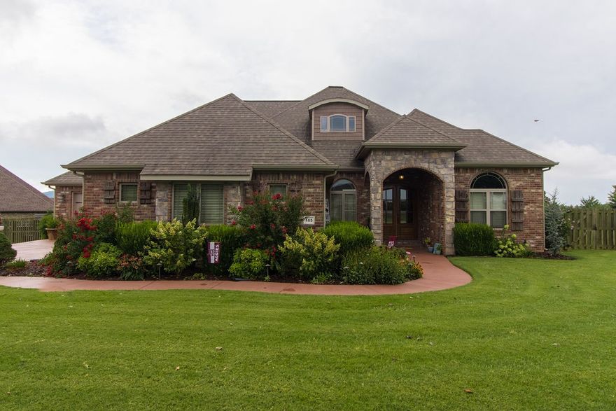 A MUST SEE! This 4 bed, 3.5 bath home on almost an acre lot in Twin Falls subdivision is loaded with upgrades! Formal dining, office with built ins plus outdoor covered patio with built-in gas grill, and outdoor fireplace! Kitchen has granite countertops, double ovens, gas cooktop, stainless appliances,  island, and bar seating. Tons of room to entertain! Open concept living room has hardwood floors, custom built-ins and large windows. Master suite has outdoor patio access, beautiful views and separate en suite bathroom with his an her vanities. Split bedroom plan has two additional bedrooms with jack and jill bath downstairs.  Bonus room and full bath upstairs.