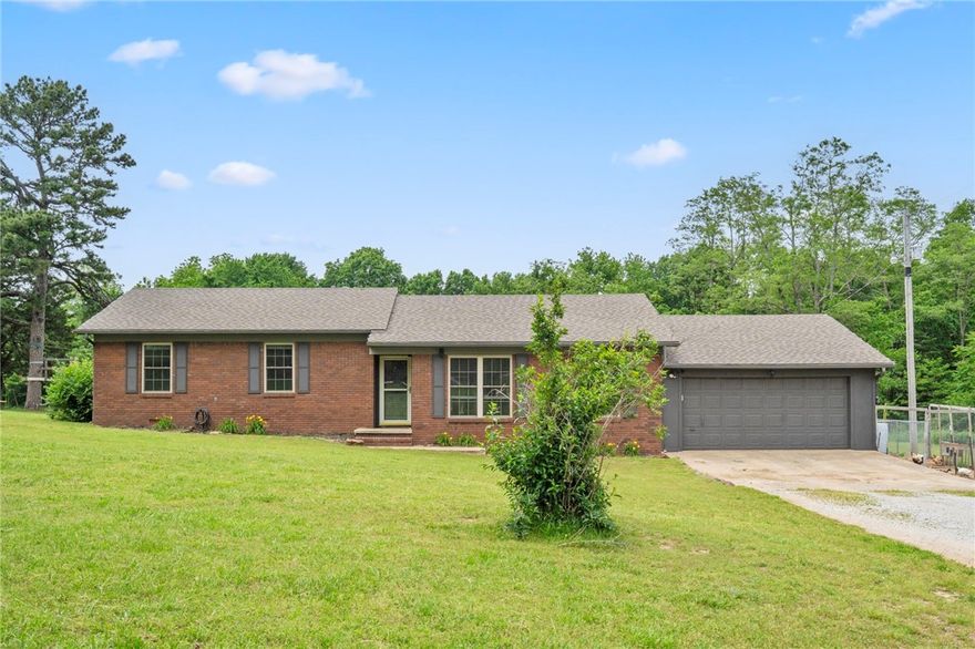 Relaxing Retreat with in-laws residence-OR- income producing rental - 6.72 Acres Near Kessler Park & U of A! Discover privacy, charm, and versatility in this 5-bedroom, 3-bath home on 6.72 acres. A spacious bonus room easily converts to a 4th bedroom or office. Enjoy a cozy wood-burning fireplace and nearby White River access—great for swimming, kayaking, or fishing. A seasonal creek & treehouse add charm & family fun. In addition to the main home, the property includes a versatile shop building now generating income as a short-term rental, with long-term potential, but makes the perfect in-laws residence for multi-generational opportunity. Furnishings in the in-law house/rental convey with an acceptable offer. 2 additional shop buildings provide space for storage or hobbies. Minutes from Kessler Park & under 10 mins. to the U of A! Devil’s Den State Park is also nearby for hiking & outdoor fun. Some updates are complete, with room for personal touches. The possibilities are endless with this amazing property!