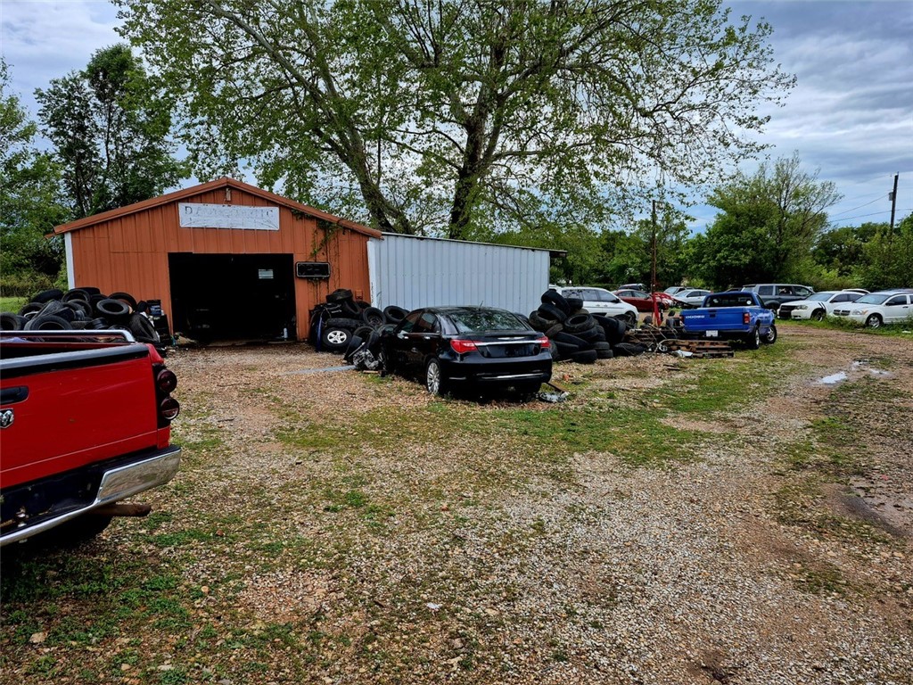 Auto Service Garage! Great opportunity with an established auto service garage, presently operating for tire change, balance tires, has lift for bigger projects. Has 60 gallon compressor, tractor (3 cylinder diesel), forklift . Car lot also. 24 hour notice needed.
