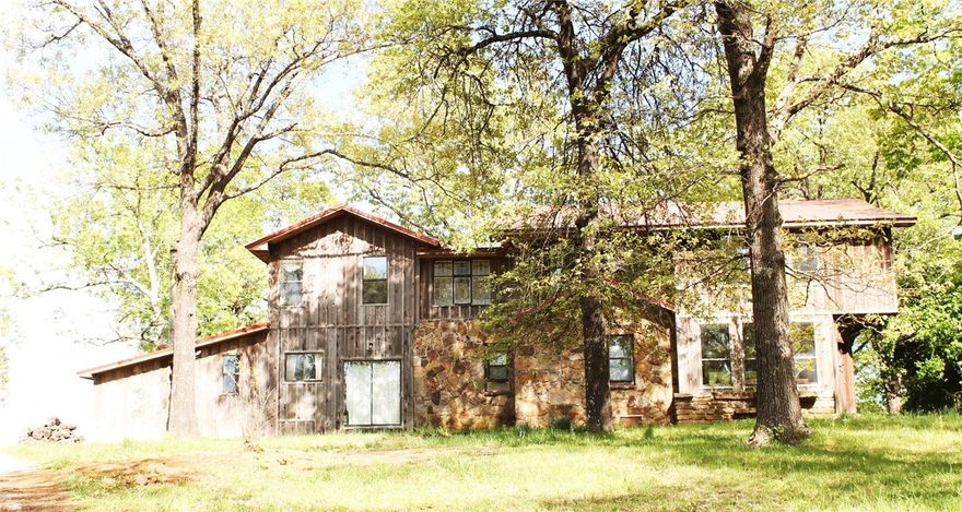 575 acre mountain top ranch/resort or get-away within Ozark National Forest! Lodge style house w/separate upper & lower level quarters. Main level w/abundance of windows to enjoy the views! Large enclosed patio w/wood stove to gather around. Large pasture/hayfields fenced/cross fenced. Large population of Whitetail Deer. 2.5 acre pond (4 stocked ponds - 7 total). Horse barn w/stalls. Suitable for 3200' airstrip. Hunting, fishing, ranching, horseback riding & family retreat! Owner financing available.