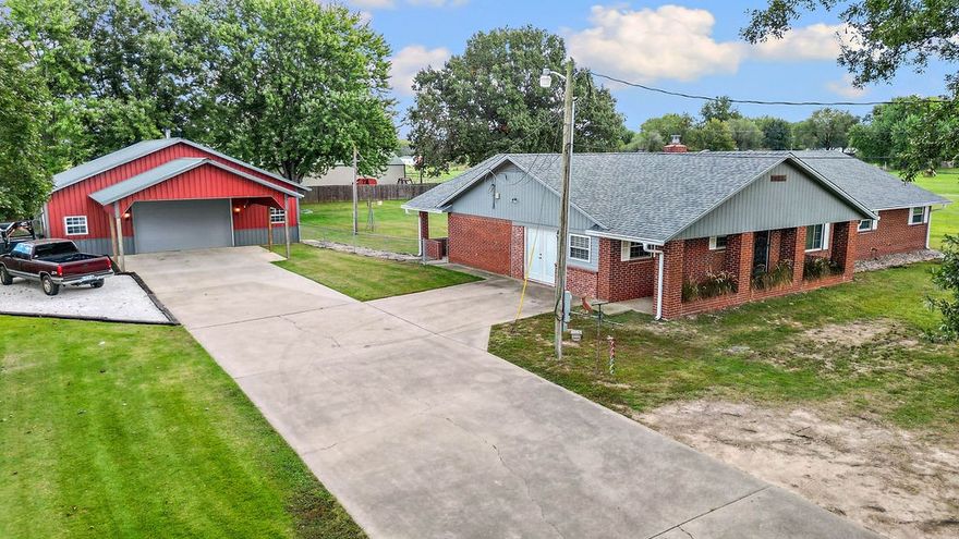 Welcome to this beautiful brick home on 1.07 acres in Farmington! This spacious property offers comfort, functionality, and room to enjoy both indoors and out. The home features two large living areas and a cozy wood-burning fireplace that is ducted throughout the home. The spacious kitchen is equipped with stainless steel appliances and offers plenty of storage throughout. Outside, enjoy a large backyard with plenty of room to play, garden, or unwind — plus a 40x40 shop, ideal for hobbies, projects, or extra storage. Experience peaceful living with convenience and space to spread out!  New roof in 2021 and new water heater in 2023! Shelving and wood stove in shop does not convey.