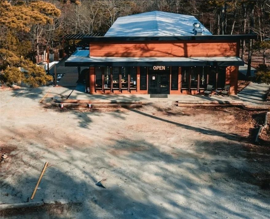 Now available—one of the newest commercial buildings in Eureka Springs! Previously a church and now operating as a restaurant and event venue, this versatile property features a 2022-installed commercial kitchen and multiple upgrades completed in 2024. Located just 1 mile from the Passion Play and minutes to downtown, it offers a prime location with endless business potential. Building only; kitchen equipment and fixtures available for purchase separately. Showings by appointment only. Do not talk to staff about property sale.