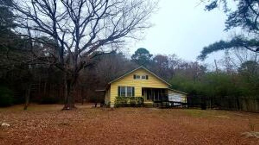 Country home with shop. 2 bedroom 1 bath on 1.96 acres. Located about 3 miles from Dardanelle. Shop is approximately 1200 sq ft. Handicap Accessible.