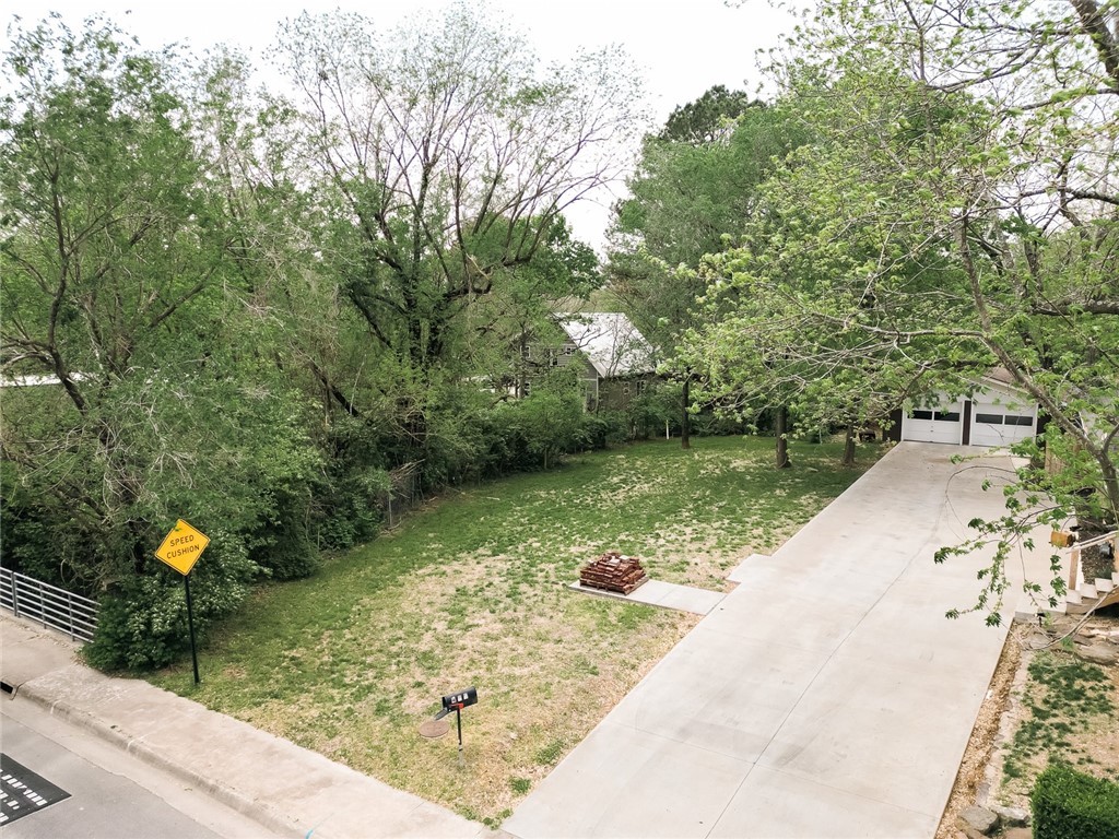 Rare opportunity to own a .14-acre lot in the heart of South Fayetteville, tucked along the peaceful Spout Spring Branch. This property includes access to a shared driveway, making it easy to create ample parking behind your future home—an ideal setup for a main house plus an accessory dwelling unit (ADU).
The site previously hosted a home, allowing you to rebuild within the original footprint and bypass the streamside protection ordinance—an advantage for maximizing your buildable area.
Located just minutes from downtown, you’re a short stroll from Feed & Folly, Crisis Brewing, and the Fayetteville Farmers Market. Whether you're a homeowner or investor, this lot offers flexibility, charm, and walkable convenience in one of the city's most vibrant neighborhoods.