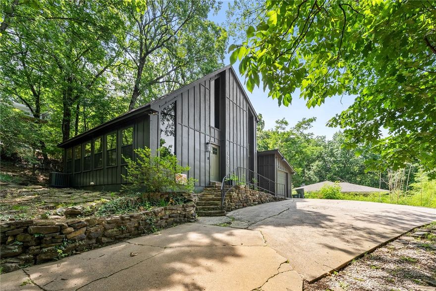 Private Retreat in the Heart of Fayetteville. This unique and stylishly renovated home is centrally located and just minutes from shopping, dining, entertainment, and more—close to everything, yet tucked away for peace and privacy.  Surrounded by mature trees, the shaded lot gives this home a secluded, low-maintenance feel—perfect for those who want the best of both convenience and tranquility. Inside, you'll find modern upgrades throughout, a layout that flows beautifully, and “cool vibes” in every corner. Currently operating as a successful short-term rental, the STR permit will convey to the new buyer, offering instant potential for passive income. All interior furnishings, including washer, dryer, and refrigerator, can also convey—just bring your toothbrush! Whether you're looking for a stylish full-time residence, a weekend game-day retreat, or a turnkey rental property, this home delivers. New roof in 2020, plus updates that make it move-in ready from day one. Don't miss this one-of-a-kind opportunity!