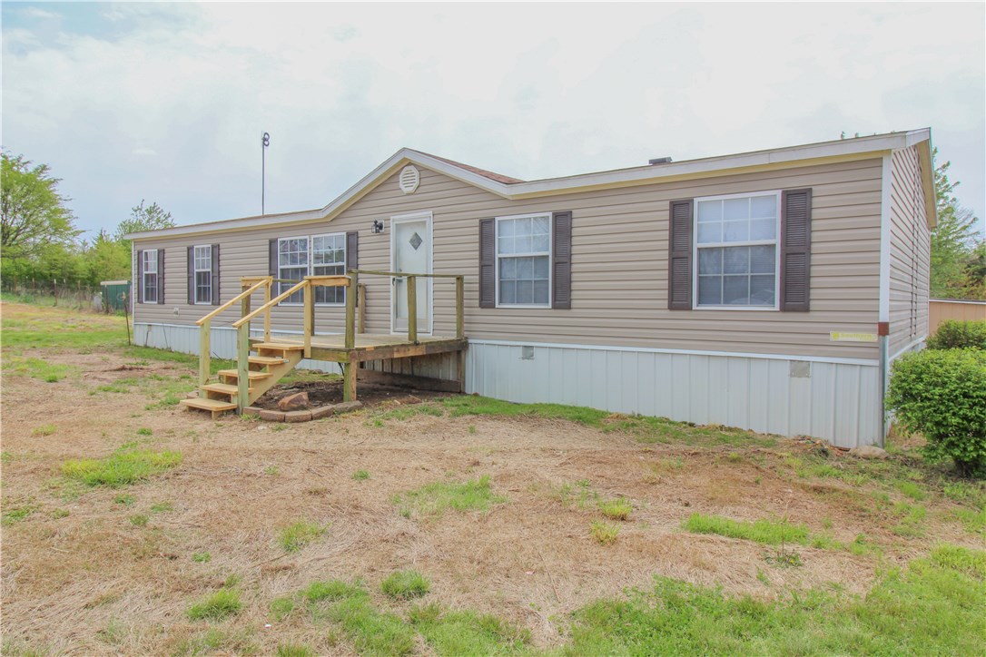 Check out this great 4 bedroom 2 bathroom split floor plan house! Featuring a large walk-in pantry, and eat in kitchen, a large laundry room, update flooring, updated walls, and updated exterior this home is move in ready. Sitting on just over 4 acres of land located out of city limits this home has a great "Country living" feel! Schedule your private showing today! - This is a bank owned property. Property to be sold "as-is."