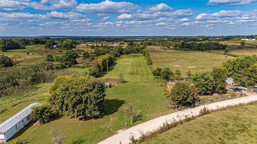 BUILD YOUR DREAM HOME! Are you looking for a location to place some roots and build your dream
home or hobby farm? Look no further! This mostly open and flat 5 acres +/-  is just what you have been waiting for! Located just outside of downtown Lincoln and a short drive to Prairie Grove! Mature trees scattered in the back of the lot with Electricity and water on site! Endless possibilities you don’t want to miss out, Act Now!