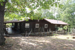 LiLive on the edge of the Buffalo National Park. Little Panther Creek on property. Three bedrooms, three full baths, kitchen with granite counters,60 KW generator, wrap around deck, screened porch off master bedroom and two master suites. Walk out basement and 30x40 wood shopwith power, full of wood working tools, loft with wood storage, and fenced garden area.