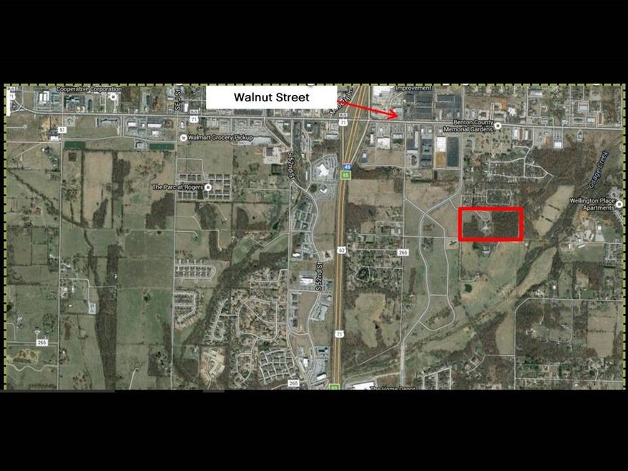 20.18 Acres in Rogers. Great opportunity for commercial development or multifamily. 1350'x698' dimensions. Close to Walnut and I-49. Utilities on site.10,000SF building on site.  Also listed as MLS# 1053295 with building.
