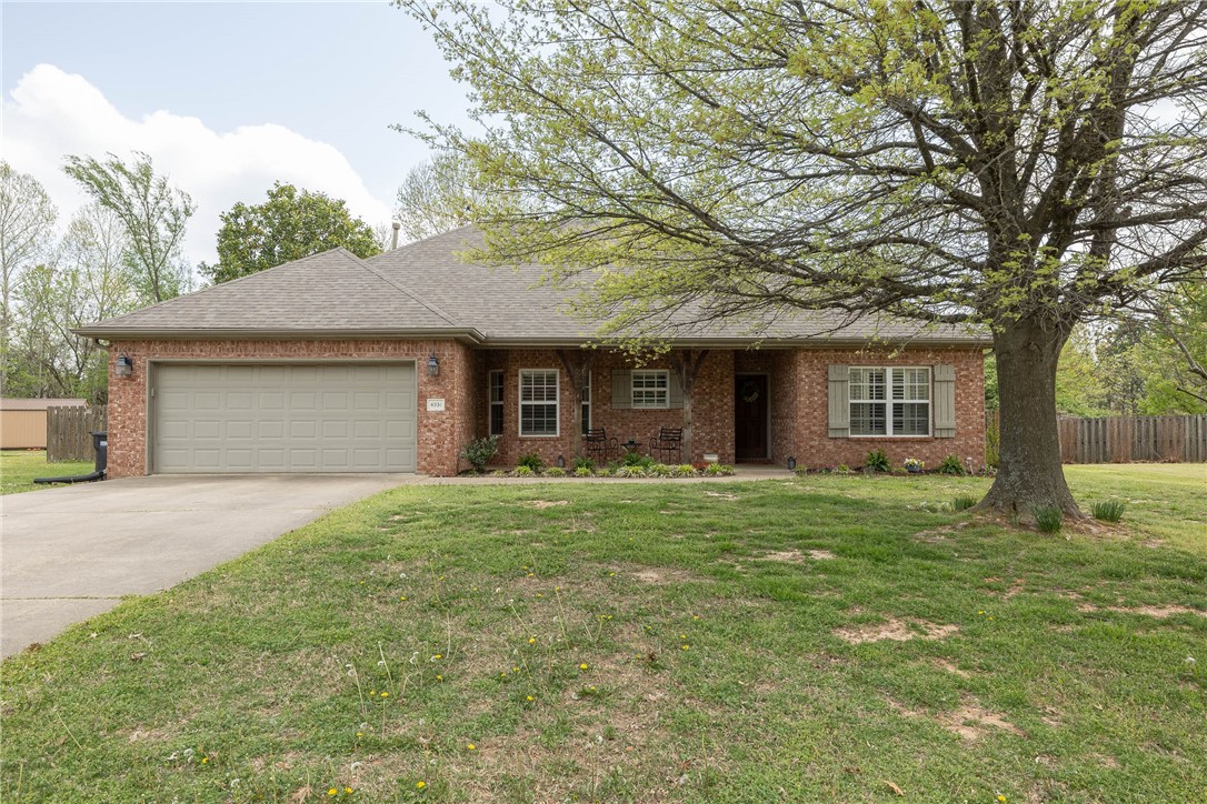 Charming all-brick, one-level home on a private 0.91-acre lot, ideally located minutes from Johnson, Springdale, & with easy access to I-49. A covered front patio & professional landscaping welcome you in. Inside, the spacious living room features soaring ceilings & a cozy gas fireplace. The kitchen offers granite counters, a bar for extra seating, & a sunny eat-in dining area. The split floor plan includes a private primary suite with tray ceiling, walk-in closet, & ensuite bath with double vanity & walk-in shower. Enjoy the outdoors on the expansive covered deck overlooking mature trees. Major updates include a NEW roof & hot water heater in 2020, plus a NEW HVAC in 2024āoffering peace of mind for years to come. A perfect blend of comfort, space, & location!
