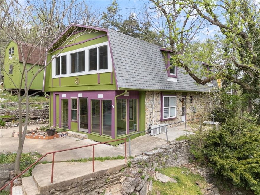 DUAL ZONING for added value- This very unique home sits on a large commercial lot that is perched high above the bustle of Main St. allowing it to be utilized as a private residence, or in a commercial capacity as a nightly rental. The back yard is a separate lot that is zoned residential. The most recent upgrades include almost $30,000 in all new Anderson Windows for the entire 2nd floor, all new kitchen appliances plus a washer and dryer to the tune of about $6,000, new hot water heater was $1,000 installed and a couple thousand was also spent on electrical upgrades, a new architectural shingle roof w/30 yr. guarantee, vinyl flooring in the kitchen, dining room and the primary bedroom upstairs, and not one, but 3 energy efficient mini splits have also been installed. My sellers have poured time, energy, and lots of money into this home over the last year but have realized that they need more support from grandparents with their ever growing family and have moved closer to the in-laws. That is a huge WIN for you!