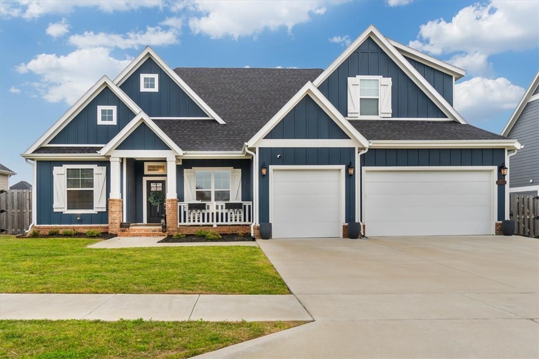 You'll be stunned when you walk in to this beautiful Craftsman style home in the Crescent View sub-division of South Rogers. The beamed living room, floor to ceiling limestone fireplace, and the open kitchen with huge island make it the perfect home for entertaining. Quartz counters, glass backsplash, 5 burner gas cooktop, and stainless appliances highlight this designer kitchen. This home boasts 4 bedrooms, 3 full baths, plus a bonus room AND an office. The primary bedroom has a spacious bath with soaking tub, and separate walk-in shower, The huge master closet opens through to the Laundry room. The 2nd Bedroom, 2nd bath and the Office also sit downstairs. Upstairs has bedrooms 3 & 4, a 3rd full bath, and the bonus room. A 3 car garage with extra storage space, insulated garage doors, privacy fenced back yard and huge covered patio leave nothing to be desired. Located near Janie Darr Elementary and the new Mt Hebron Park, this home has easy access to everything NWA has to offer. This one won't last long.
