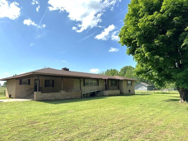 I get the call all the time that says I want a house out of town but not too far out of town and no dirt roads! Well... here it is. This four bedroom 2 1/2 bath home has been owned by one family, the family that built it, for 60 years. It's all brick home in great shape. Could it use some updates. Maybe. It just depends on your taste in decor. It has a great view of Gaither Mountain. There is beautiful farmland behind the house owned by the same family selling the home. There is a full unfinished basement with a walkout garage door. I'm told this is where two generations spent most of their free time tinkering in the shop. There is a ramp in place for wheelchair access, but it can be removed, and the handrail replaced if you desire. Come take a look today!