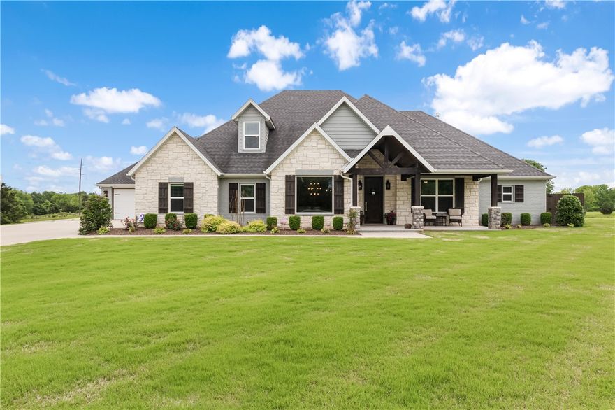 Meticulously maintained 4 bedroom 4.5 bath home with open layout set up & designed to entertain. Custom-Built in 2016, sitting on 2.78 perfectly manicured acres in highly desirable East Fayetteville. 1 full acre fenced, garden area fenced, outdoor fire pit covered by a pergola. Large covered patio with quartz countertops, built in grill, mini refrigerator & 42" gas fireplace are the perfect place to relax after a swim in the heated Gunite pool, surrounded by cool-crete decking. Two primary suites on the main level plus one bed with private bath. Bonus room plus 1 bedroom & full bath upstairs. Kitchen features a waterfall island with Quartzite Countertops, built-in wet bar, ice maker, & walk in pantry. Living room boasts 51" Napoleon Linear gas fireplace, upgraded fixtures throughout, & showcases hand-hewn beams in living room ceiling. Surround sound inside & out. Attached 4 car garage offers tons of storage, & a built-in safe room. New pool heater, new HVAC, & new thermostats are part of recent updates.