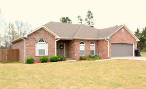 Lovely home in a country location minutes from town with a beautiful, open split floor plan, formal dining area, large living room, spacious master with jacuzzi tub, separate shower, and walk in closet. You'll love the hardwood floors and the large bright windows. Outside you'll find the perfect place to play with a fenced yard and nice deck. What a great place to call home!