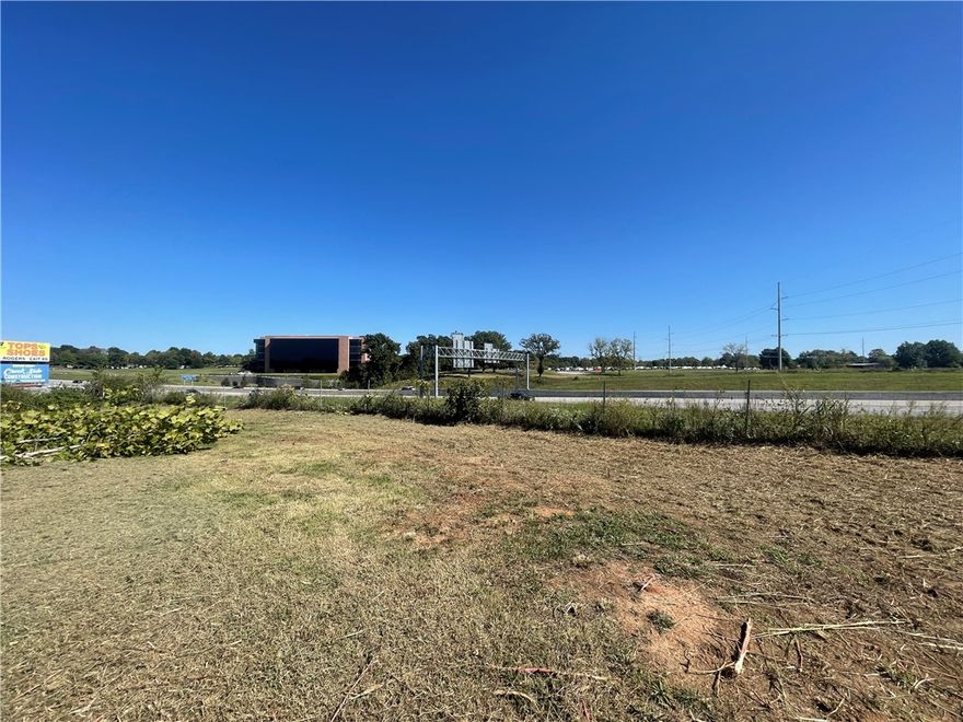 1.58+/- acres of prime commercial property, visible from I-49 with 102,000 daily travelers and directly across the highway from JB Hunt Transportation Headquarters. The opportunities are endless! Zoned C-2. Public water, electric, & gas are on site.