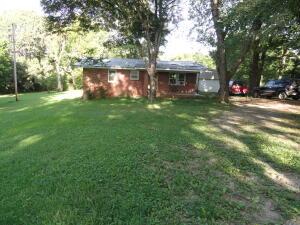 Nice 2 bed 1 bath, all brick house in Marshall built in 1970 but totally remodeled in 2011 with new metal roof, new flooring (hardwood and ceramic tile), Whirlpool kitchen appliances, oak cabinets, double pane vinyl windows, floor insulation, extra insulation in attic, detached shop/garage, large back yard for a garden area, large shade trees and on a dead end street. This house has a 1/4 basement area that is heated & cooled which could be used as a guest bedroom with outside access only.