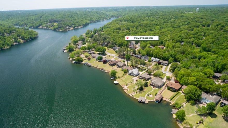 Home w/FLAT Lakefront Lot! Private Dock. Central Bella Vista location minutes to multiple mountain bike trails & parks! Great space throughout including 4 Bedrooms, 2 Living Areas, Oversized Garage, and Screened – In Porch. Entry opens to the huge living, dining, kitchen space. A large stone wood burning fireplace and abundant windows looking out to lake. Kitchen has stainless appliances and plenty cabinet space and built in desk area. 2 guest bedrooms and guest bath on main level. Master bedroom on main level with attached bath and walk in closet plus 2 additional closets. Large sunroom off living area is a beautiful outdoor living space. Downstairs is the 2nd living area with fireplace and access to covered patio. A large guest bedroom and guest bath on lower level. A short and flat walk to the water and to your private dock on Lake Windsor, a true rarity in Bella Vista! Enjoy fantastic community amenities including gyms, pools, parks, restaurants, and so much more!