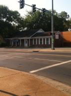 Corner Location, sides on Rogers. Well Maintained Building has worked well for different offices. Has break room, 2 - 1/2 baths.Broker Owned.