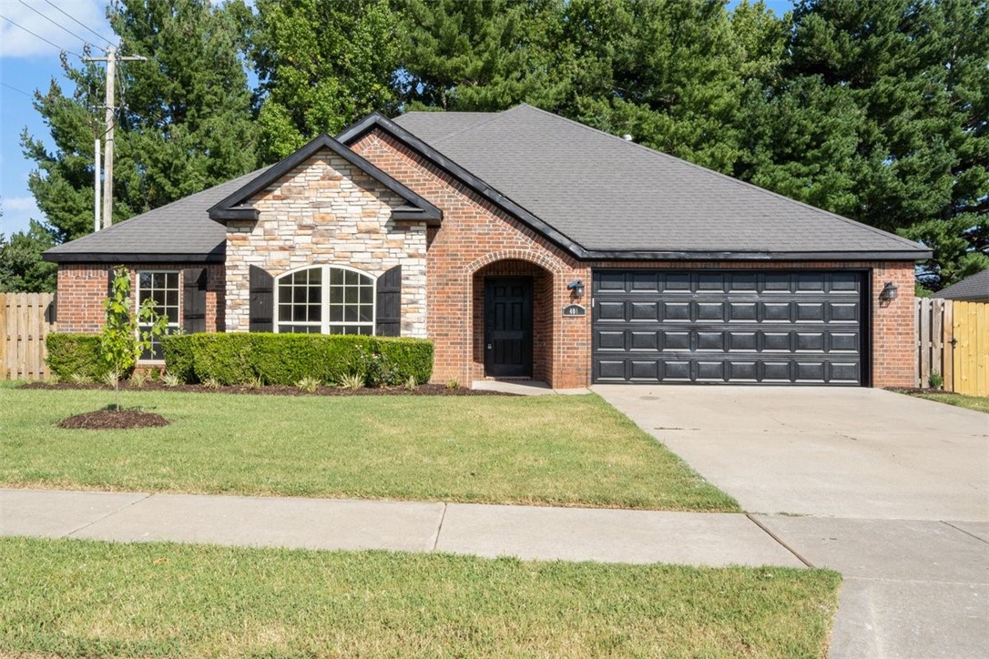 Discover the epitome of charm and modern comfort in this remodeled gem located in the heart of the Keystone Subdivision. Nestled on a corner lot, this adorable residence offers the perfect blend of character and convenience. Step inside and be greeted by the warmth of a fireplace and an abundance of natural light, setting the tone for a cozy and welcoming living space. The white cabinets and white subway tile backsplash in the kitchen contribute to the home's contemporary flair and open concept design. The large master bedroom offers a sanctuary of relaxation, while the adjoining master bathroom features his and hers walk-in closets, making organization a breeze. Boasting an enviable location less than 5 minutes from the fire department, schools, and the scenic Coler trail, and less than 10 minutes from downtown Bentonville, this home defines easy living at its finest. This charming home is more than just a propertyāit's an opportunity to embrace the lifestyle you've been searching for.
